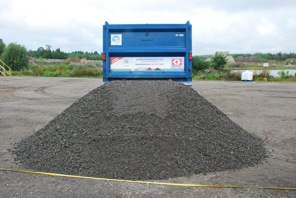 Back of truck with gravel pile